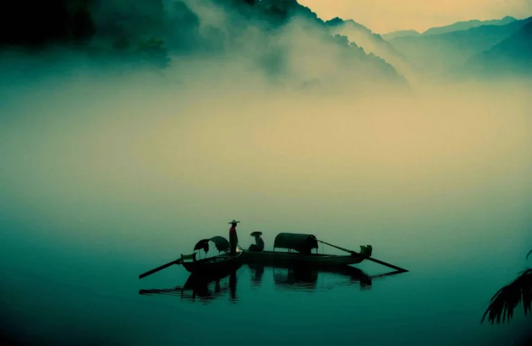 Two persons on fishing boats signifying the value of exploring world literature.